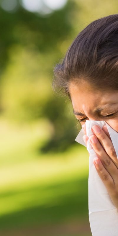 Close-up,Of,A,Young,Woman,Blowing,Nose,With,Tissue,Paper